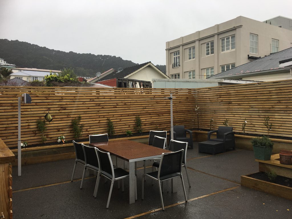 Paved courtyard, hillside outlook